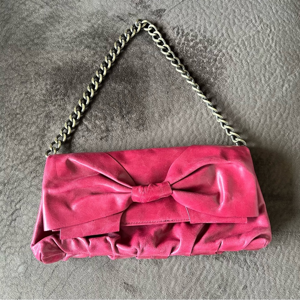 HOBO INTERNATIONAL red leather bow clutch with chain